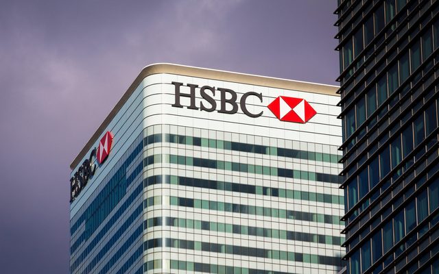 HSBC Bank headquarters building on stormy day in Canary Wharf, Docklands, London, England, UK